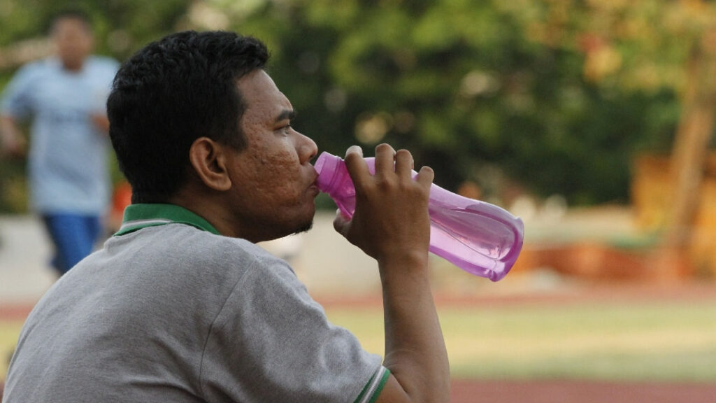 A man drinking water